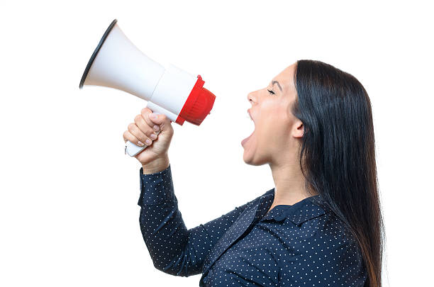 istock Young woman shouting into a megaphone 577326438