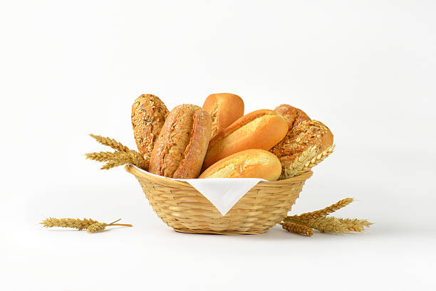 bread rolls and buns basket of various bread rolls and buns on white background bread photos stock pictures, royalty-free photos & images