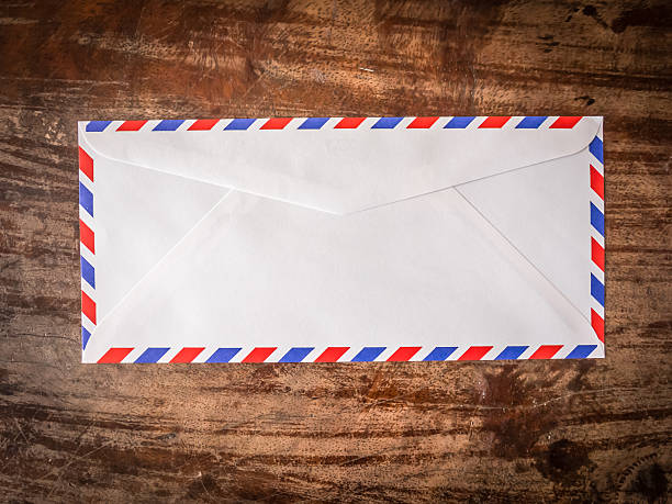 istock Air mail letter on wood background. 577327500