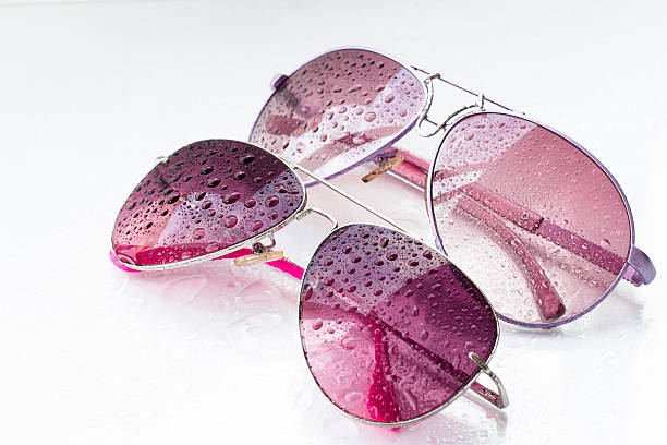 istock rose sunglasses and drops on an isolated background 577327540