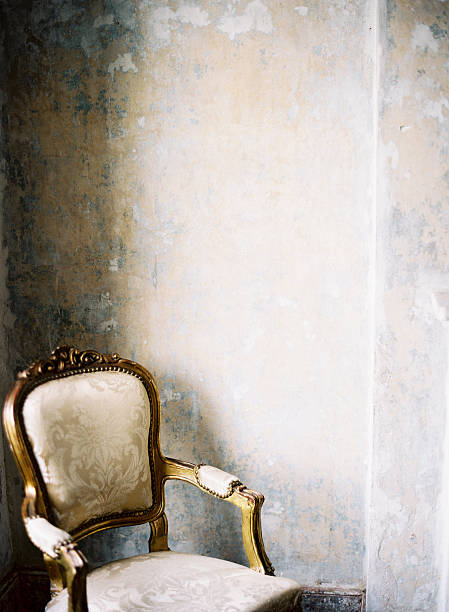 istock Gold cushioned chair in Georgian decor 577330534