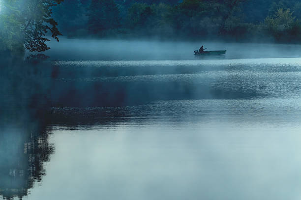 istock Boat in the morning fog 577330874