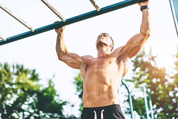 istock muscular man exercise outdoors 577332036
