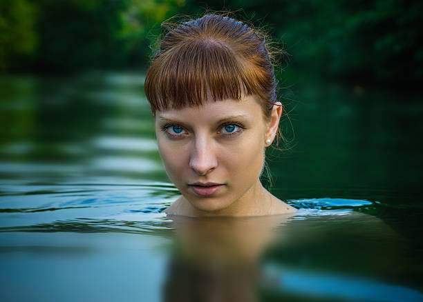 istock Beautiful girl in the river 577333084