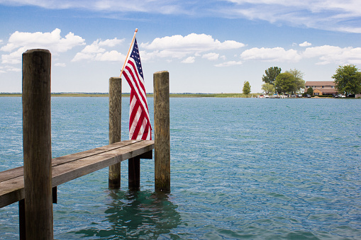 American flag on a pontoon on a lake, lake saint Clair, Michigan