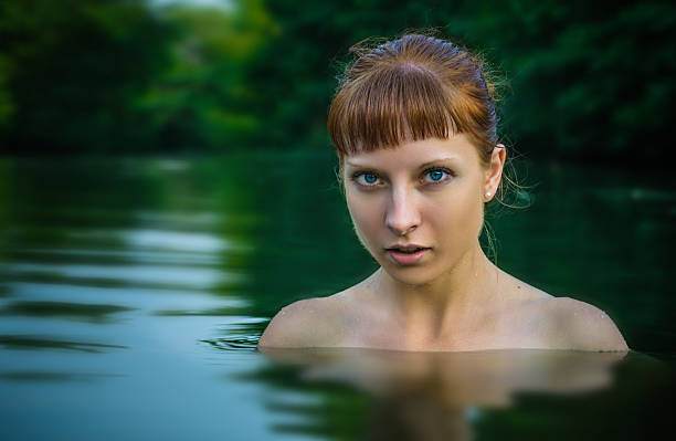 istock Beautiful girl in the river 577334290