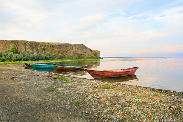 istock fishing boats at river bank Volga 577334612
