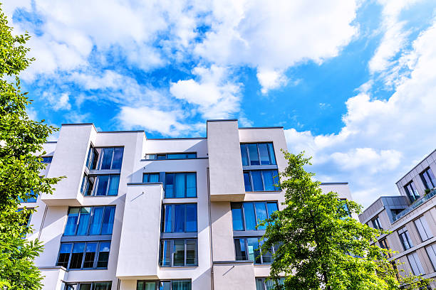 istock modern apartment houses with cloudy sky 577336742