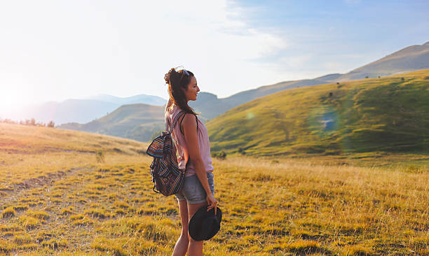 istock Young woman walking in the nature 577337176