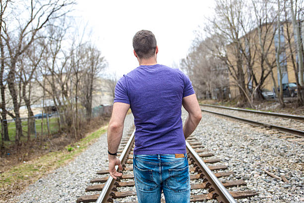 istock nice young man portrait on the railroad 577337448