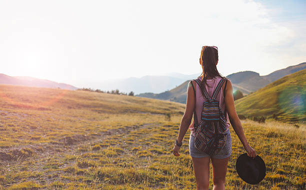 istock Young woman walking in the nature 577337606