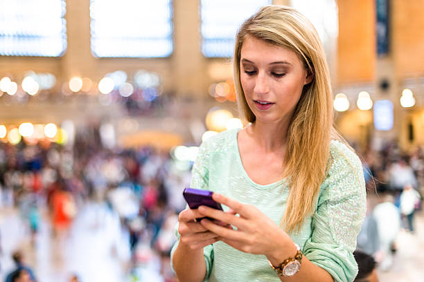 istock woman using the phone in new york city 577337610