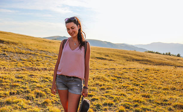 istock Young woman walking in the nature 577337812