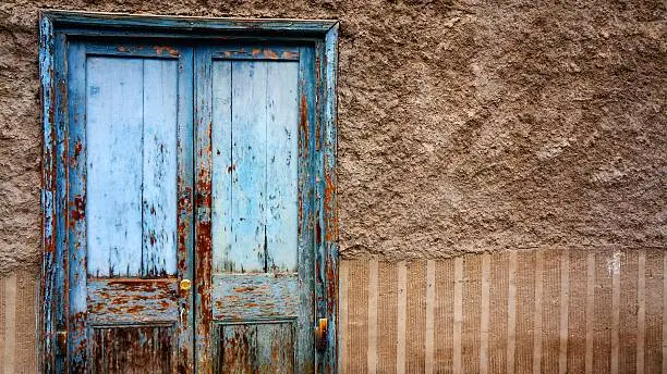 Distressed wood door found along the quiet streets of Pisco Elqui, Chile.