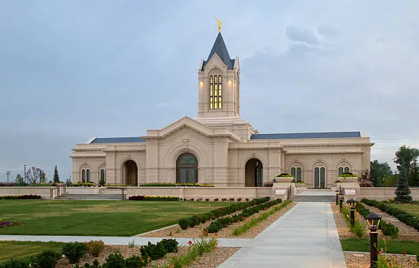 The Fort Collins Colorado Temple at sunrise on a cloudy day. The Church of Jesus Christ of Latter-Day Saints Temple in Fort Collins Colorado newly bulit Temple lit in the morning light