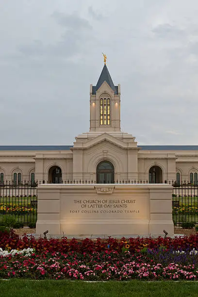 The Fort Collins Colorado Temple at sunrise on a cloudy day. The Church of Jesus Christ of Latter-Day Saints Temple in Fort Collins Colorado newly bulit Temple lit in the morning light