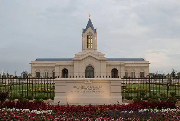 The Fort Collins Colorado Temple at sunrise on a cloudy day. The Church of Jesus Christ of Latter-Day Saints Temple in Fort Collins Colorado newly bulit Temple lit in the morning light