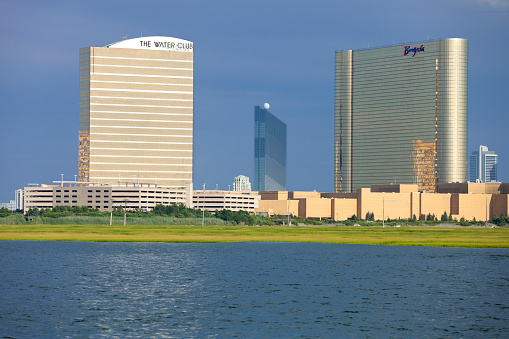 Atlantic City, New Jersey, USA - July 16, 2016: Bay view of the Borgata Casino & Hotel with the Water Club and Reval Casino (center background) located in the marina district in the north end of Atlantic City, New Jersey. 