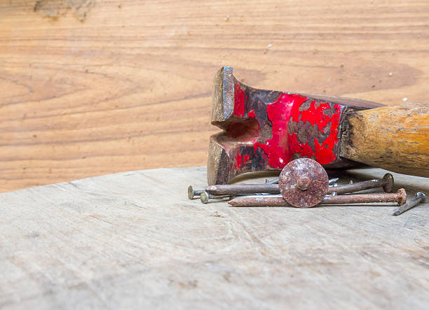 istock Old hammer and nails on the wood 577347082