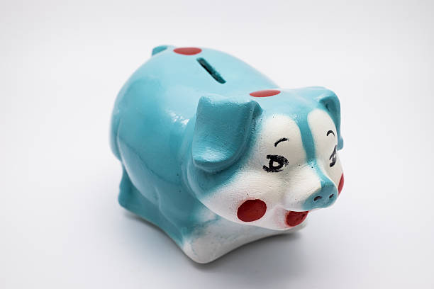 istock blue piggy bank  on whit background 577347154