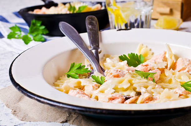 istock Pasta farfalle with salmon 577347756