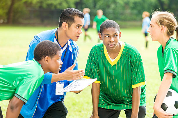 istock Hispanic soccer coach gives team a pep talk 577348030