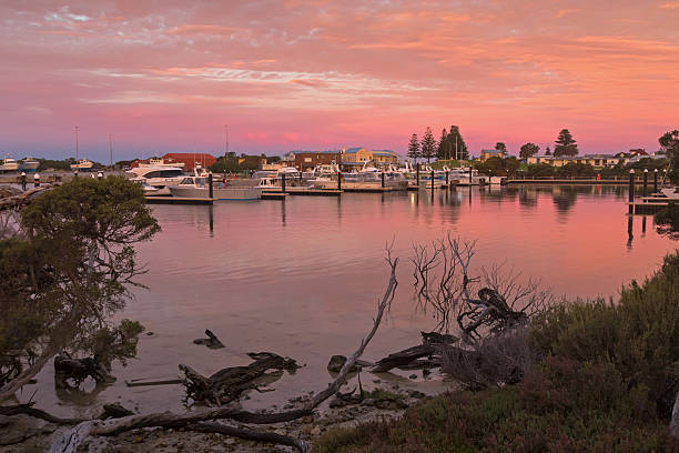 Pink sky over Lake Butler boat marina during sunset, Robe