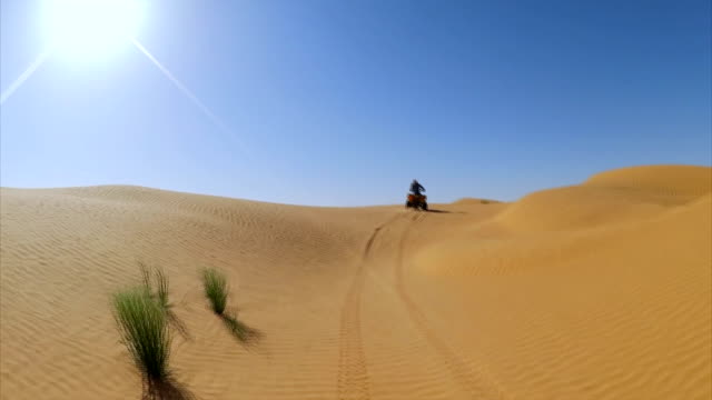 Quad Tour in Sahara desert near Ksar Ghilane oasis , Tunisia / Africa