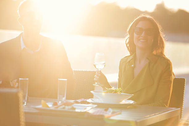 istock Couple with wine in outdoor restaurant 577620534