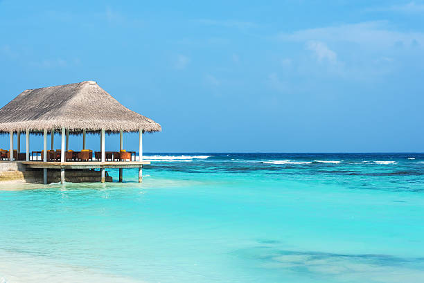 istock Water gazebo beside tropical beach 577621598