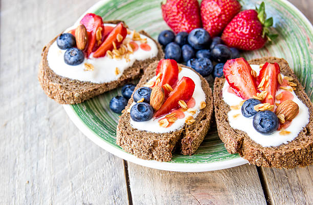 istock Sandwiches with fruits. Healthy breakfast concept 577621912