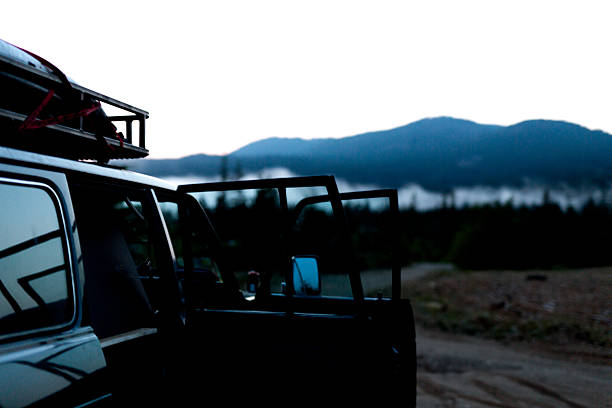 istock Logging Road Car and Evening Fog 577623828