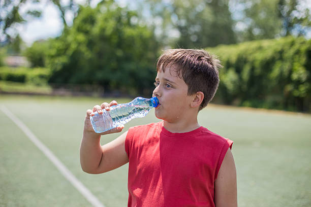 istock Boy with a football in hand 577624104