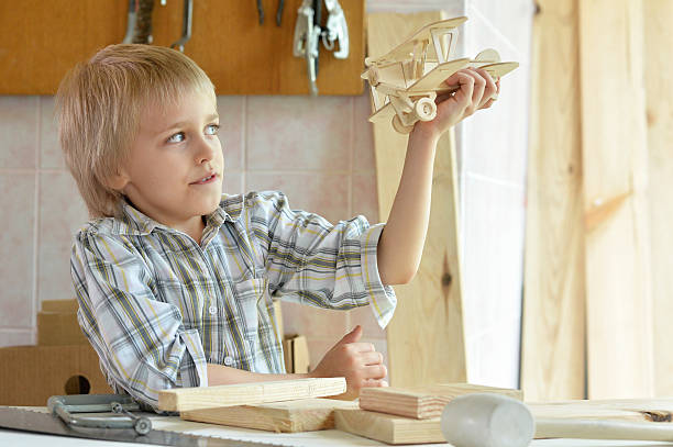 istock little boy  working with wood 577626922