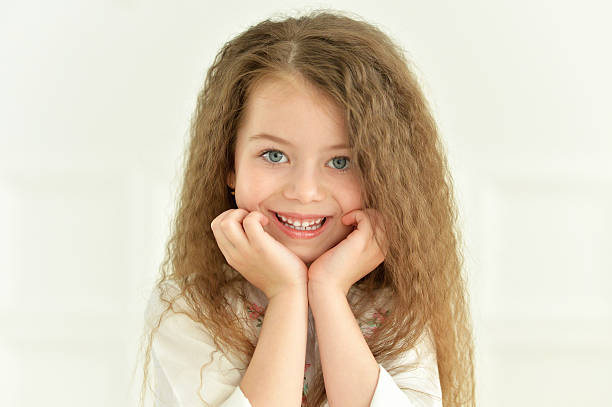 istock cute little girl posing 577630678