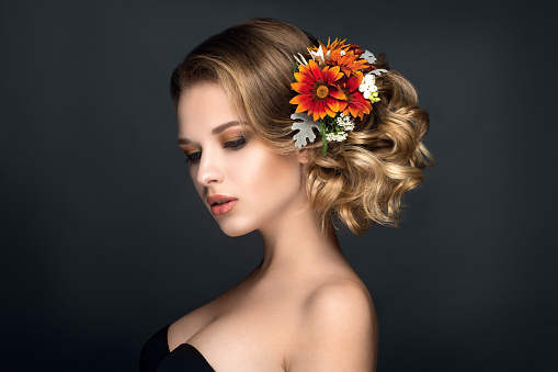 Beautiful woman portrait with flowers in hair. Autumn brideBeautiful woman portrait with flowers in hair. Autumn bride