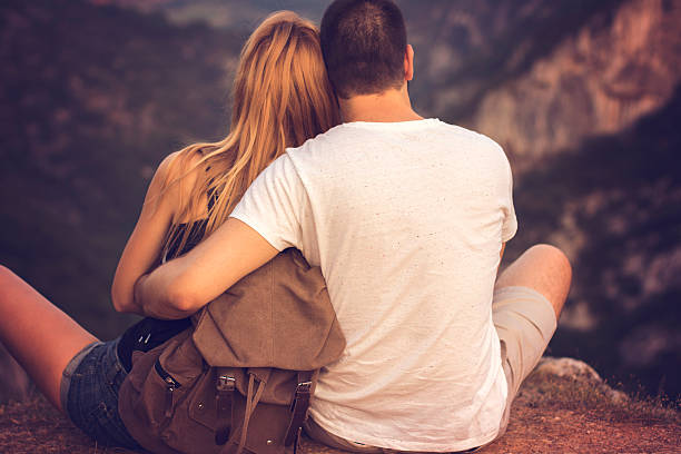 istock Beautiful couple cuddle in the mountain 577634458