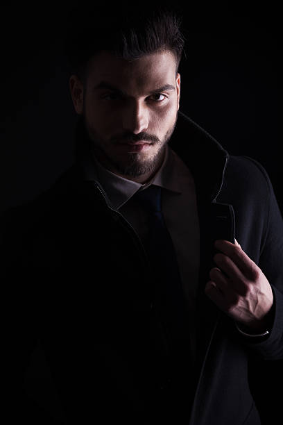 istock young business man holding his hand on the collar 577634482