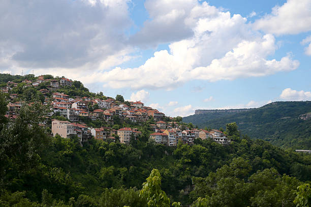 istock Town on the hills and mountains under clouds 577634764