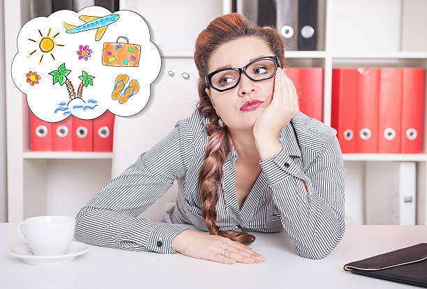Bored business woman dreaming about holiday. Overwork concept stock photo