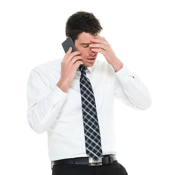istock Sad businessman talking on phone 577638316