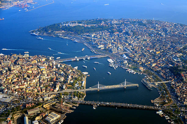 Istanbul from the air - cityscape - Turkey Istanbul from the air - view along the Golden Horn, Eminonu on the right and Beyoglu on the left - Topkapi palace, Blue Mosque, Hagia Sofia cathedral - cityscape - the Golden Horn joins the Bosphorus Strait where the strait meets the Sea of Marmara - Turkey golden horn istanbul photos stock pictures, royalty-free photos & images