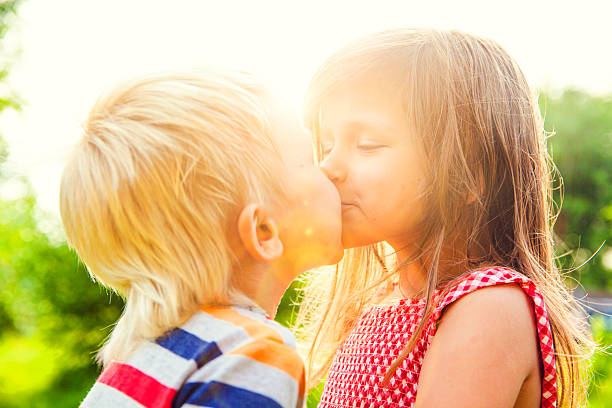 istock Shildren kissing 577639696
