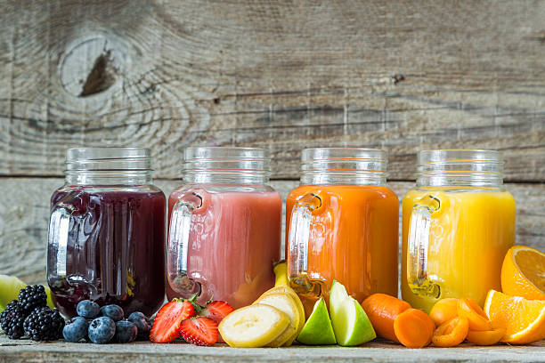 istock Slection of fresh fruit juices in jars 577640046