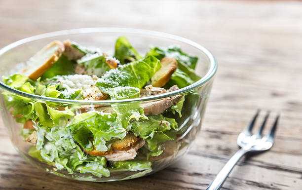 istock Bowl of chicken Caesar salad 577640542