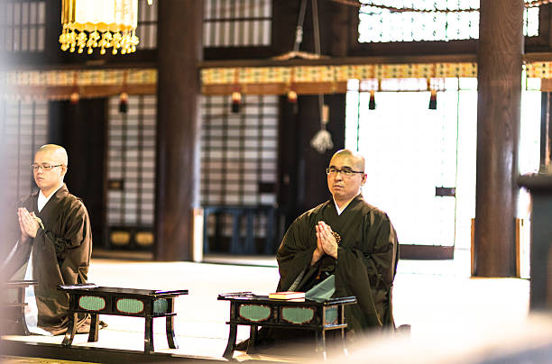 istock monk praing at the temple 577642170