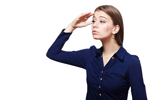 istock business woman shading her eyes 577642370