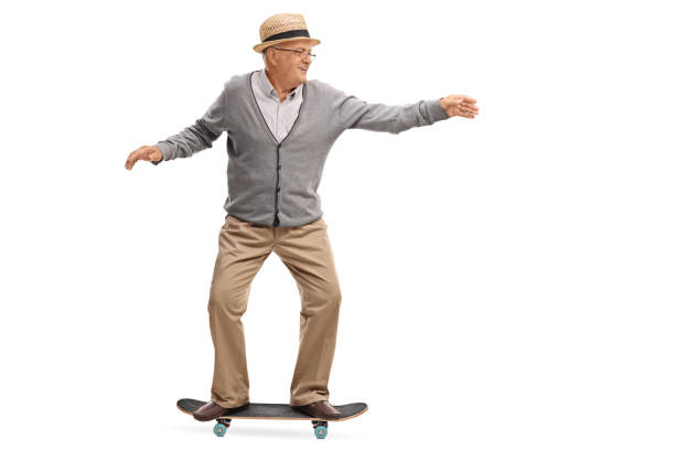 istock Joyful senior man riding a skateboard 577643408