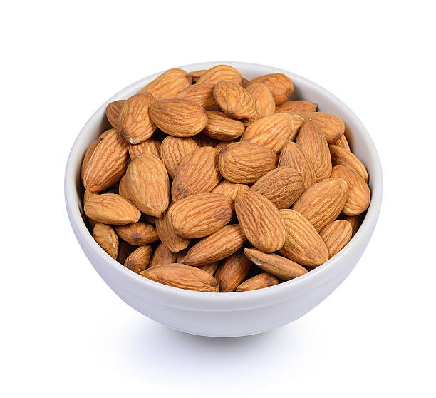 istock Dried almond in white bowl on white background. 577644130