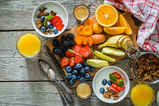 istock Breakfast - yogurt with fruits granola and coffee 577644416
